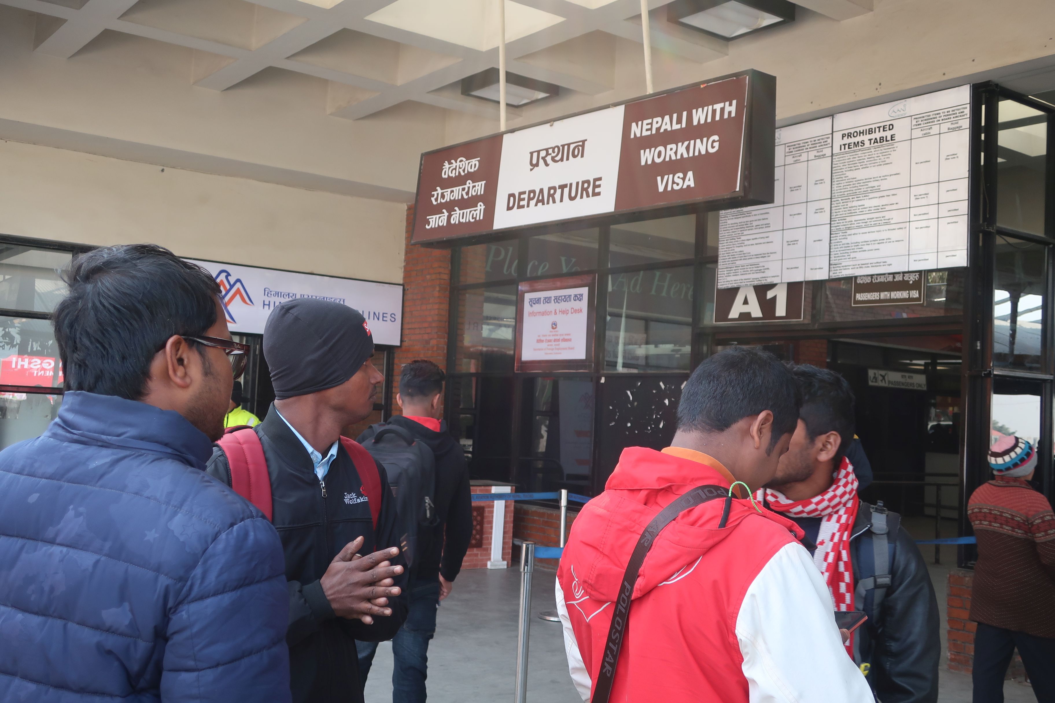 Nepali migrants ready to leave the airport for work