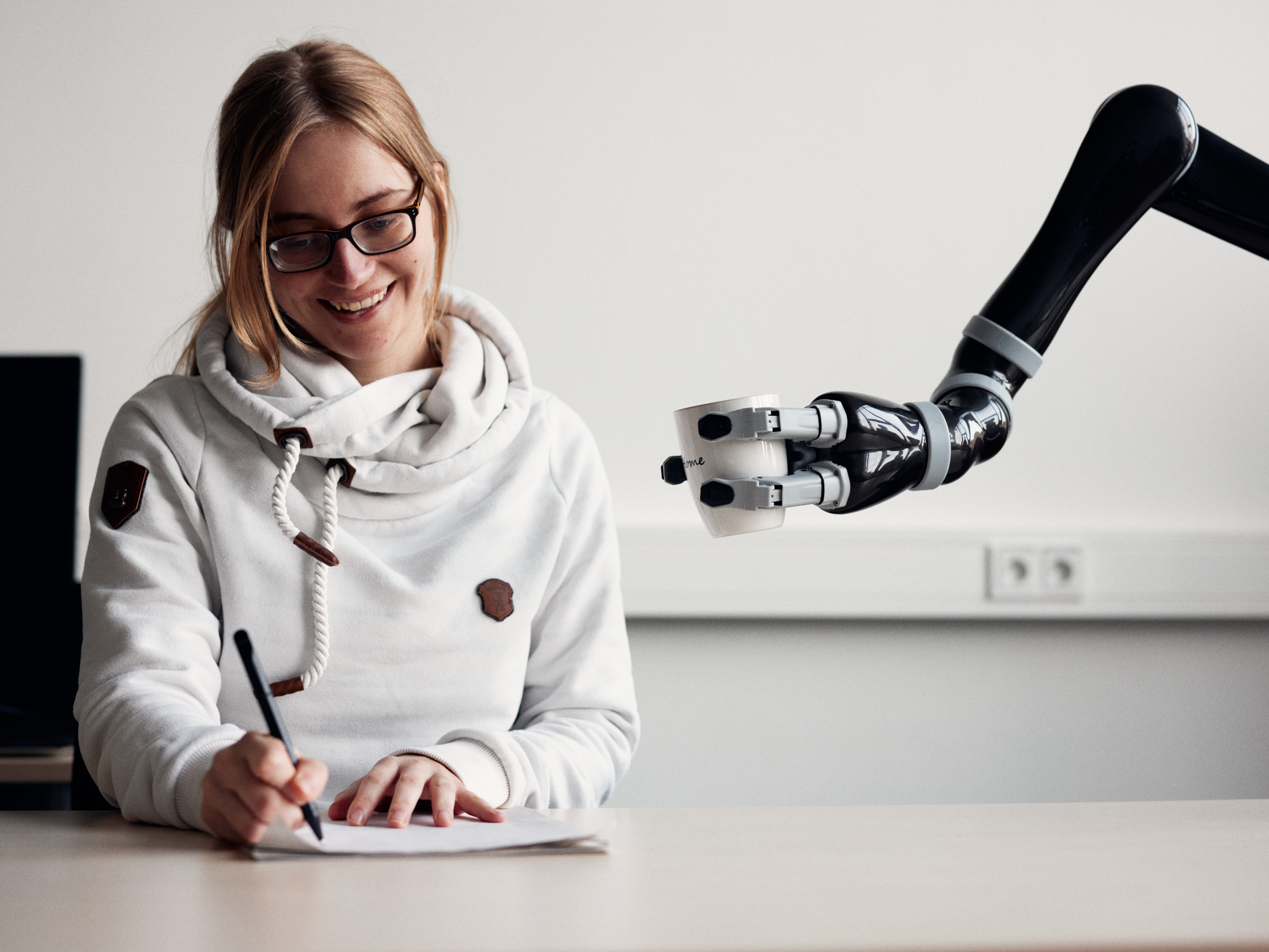 Robot hands over a cup of tea