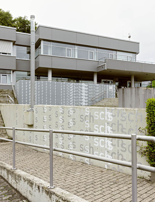 Freytag's sprayed letters on ZiF's concrete walls