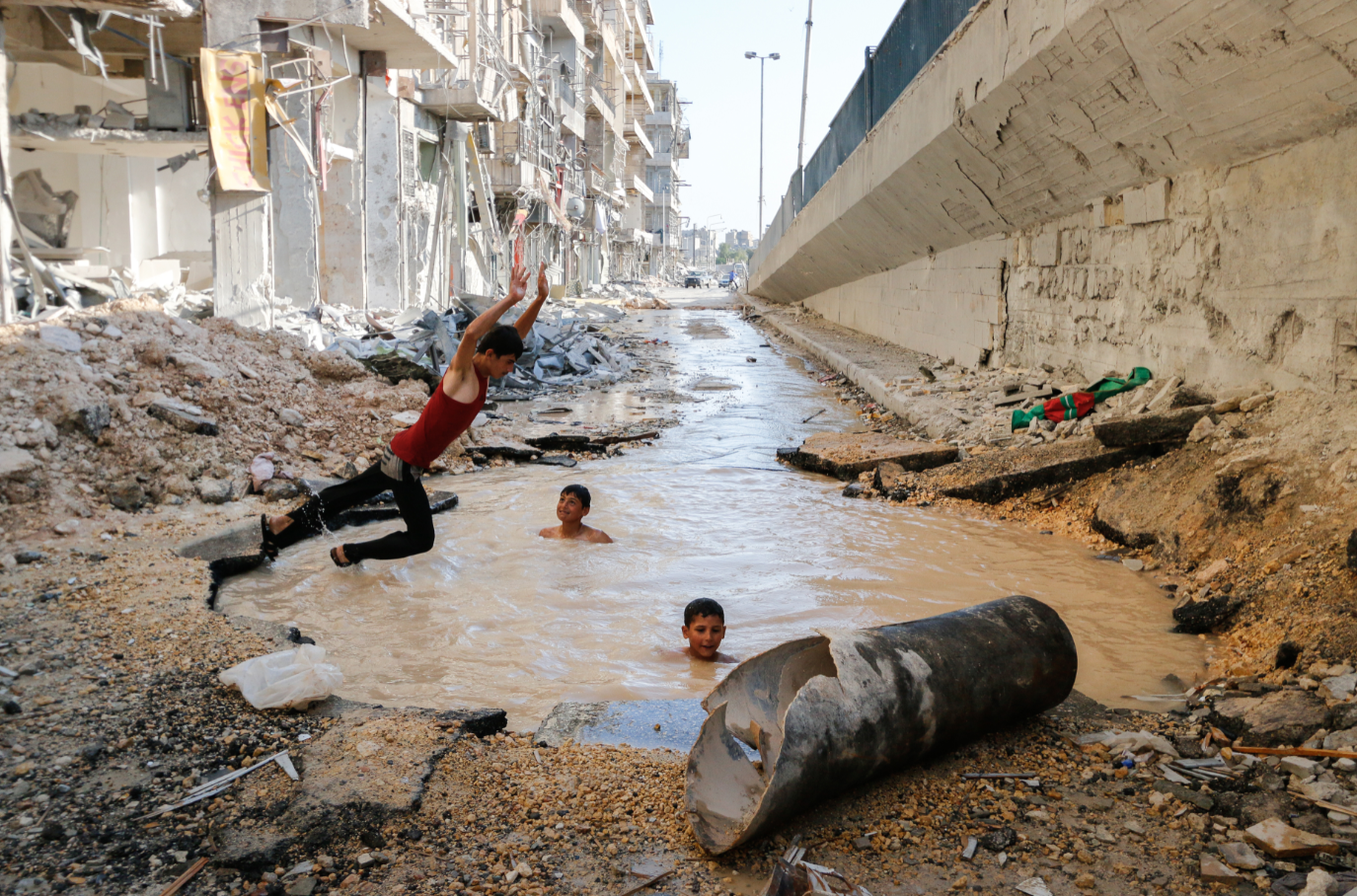 Kids having fun in broken sewer